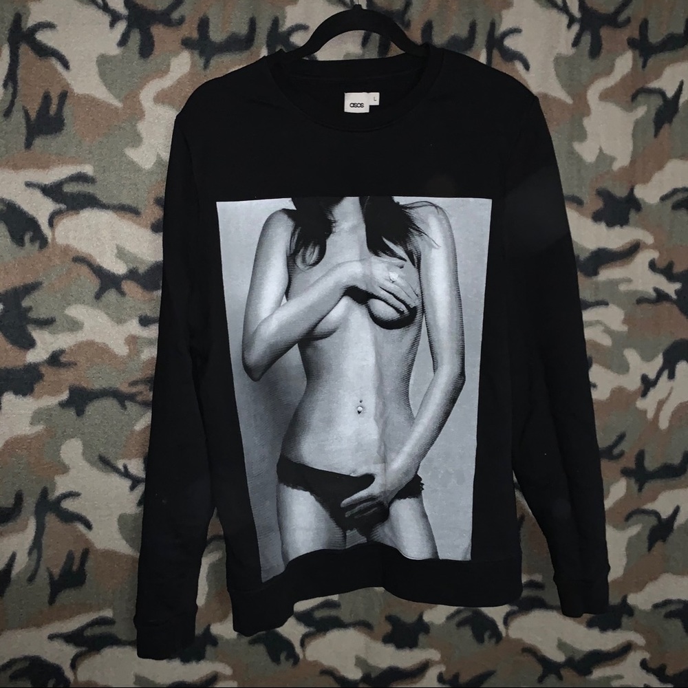 Black ASOS sweatshirt with fit woman on display